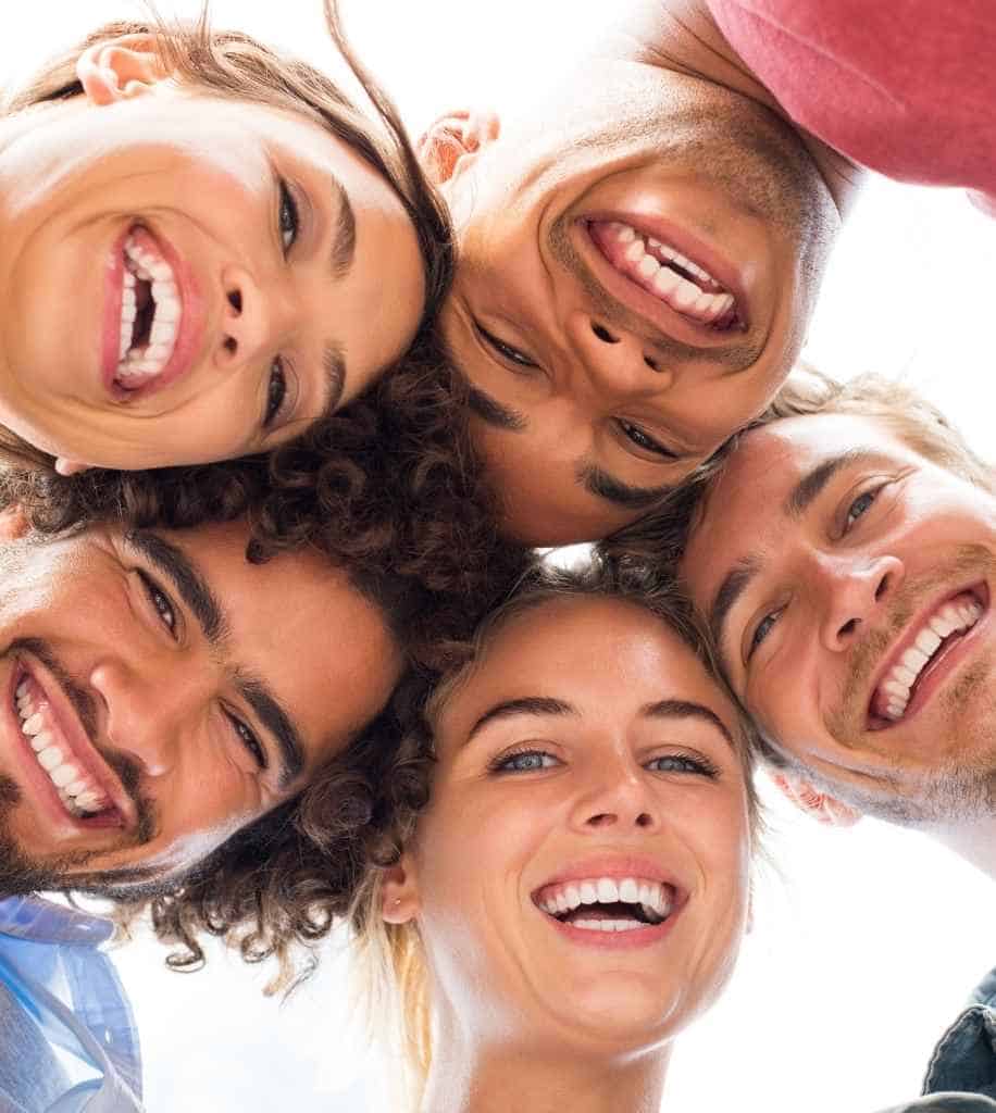 Smiling person showcasing white teeth after laser whitening treatment Ipswich